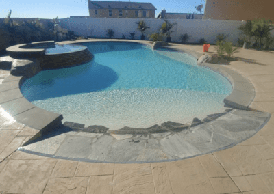 A swimming pool in a backyard.
